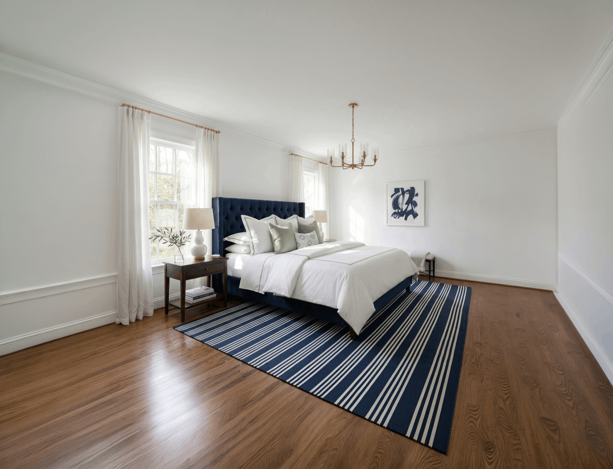 15 Creative preppy room ideas featuring a navy striped rug and white linens with green piping.