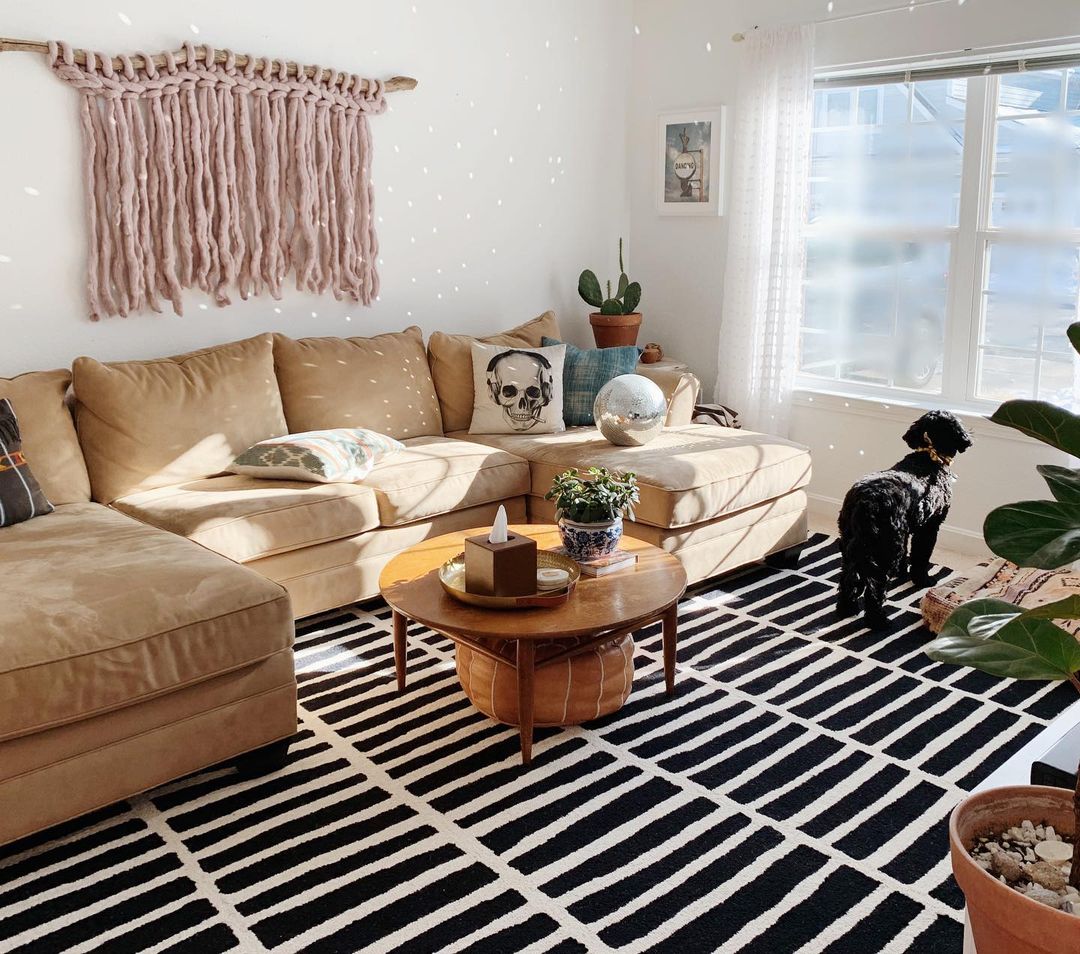 Modern boho living room with neutral tones, layered textures, and natural materials
