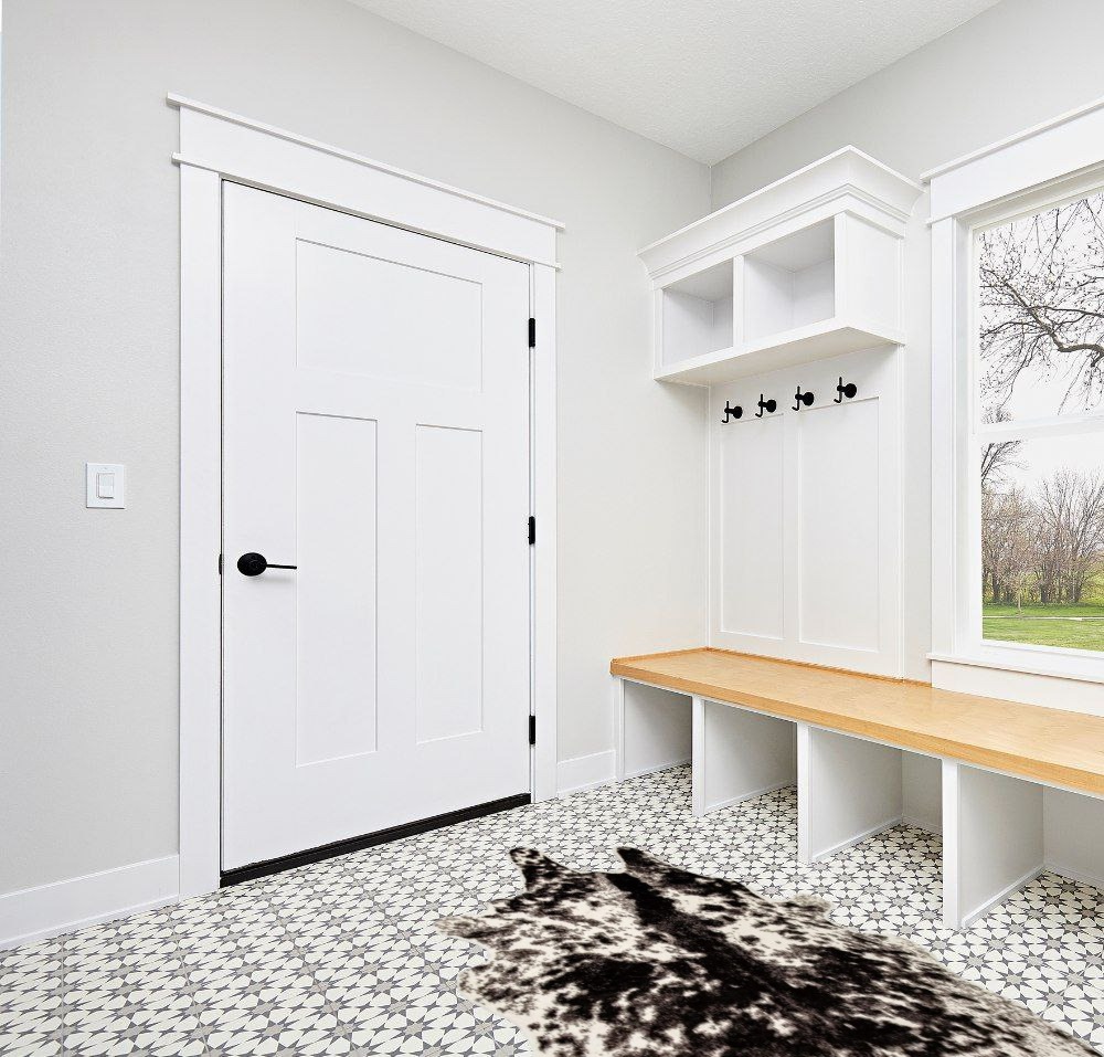 Cowhide rug decor ideas in White Modern Entryway