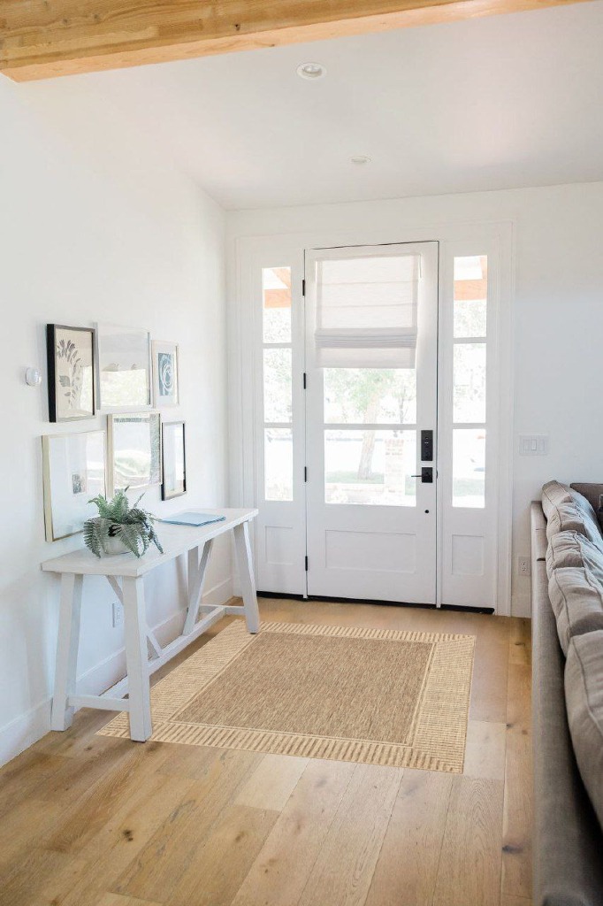 Small powder room rug ideas in White Scandinavian Entryway
