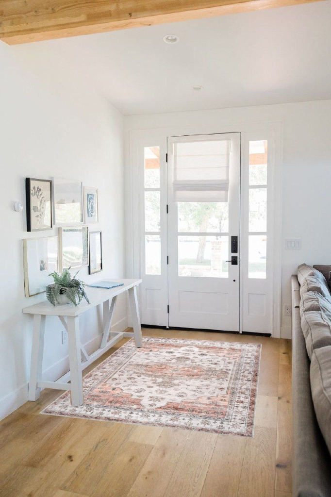 Small powder room rug ideas in White Scandinavian Entryway