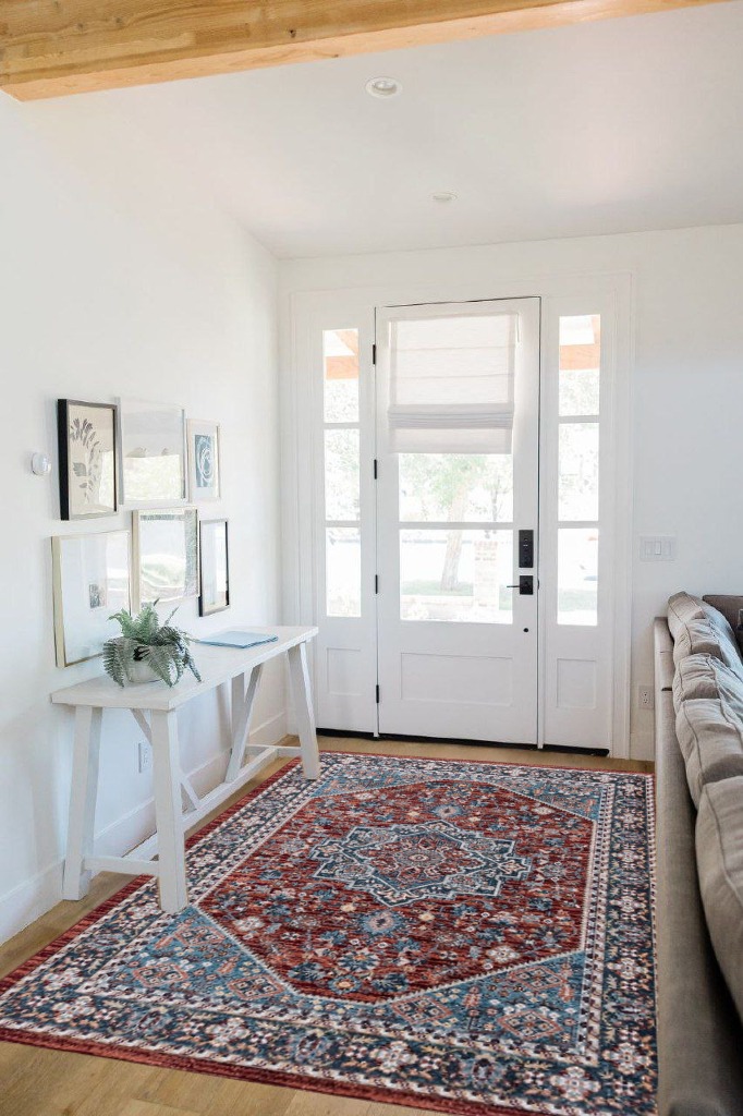 Oriental rug decorating ideas in White Scandinavian Entryway