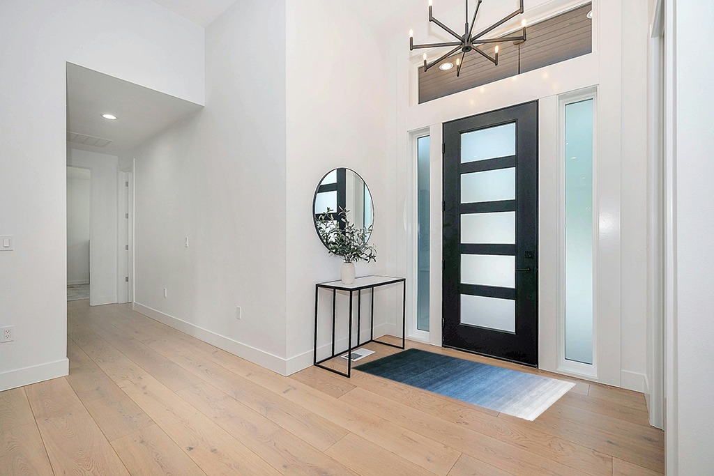 Modern area rug ideas in Modern White Entryway