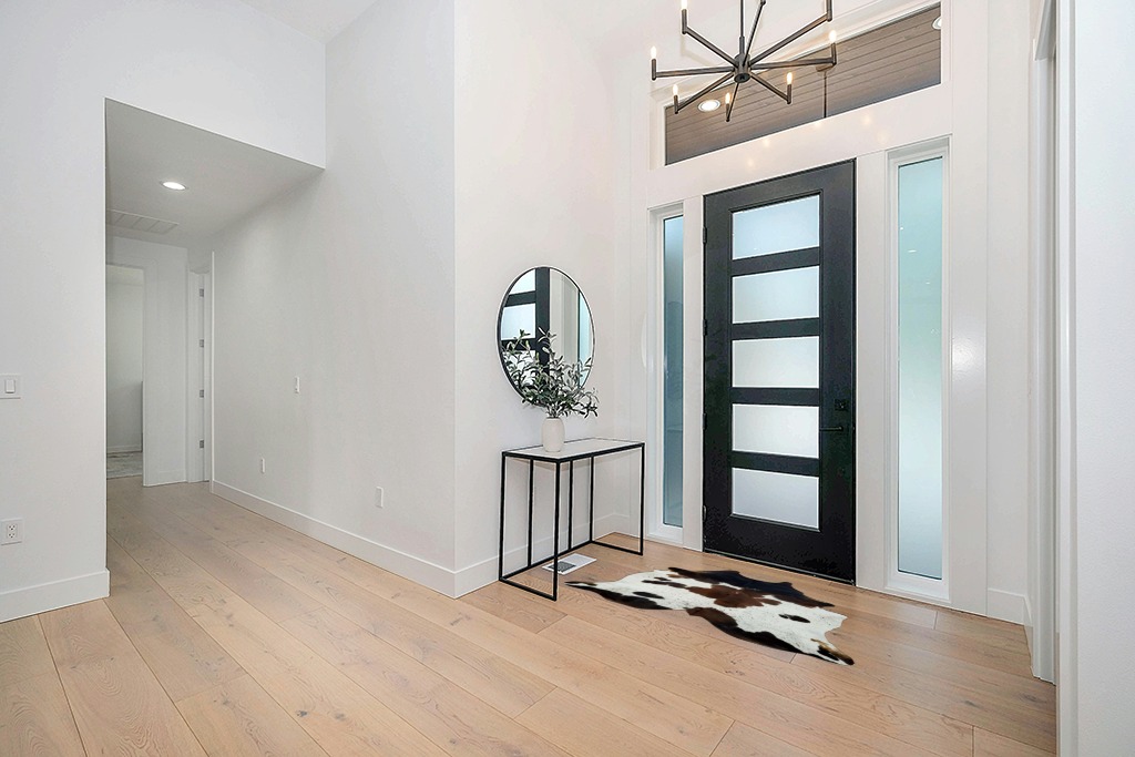 Cowhide rug decor ideas in Modern White Entryway