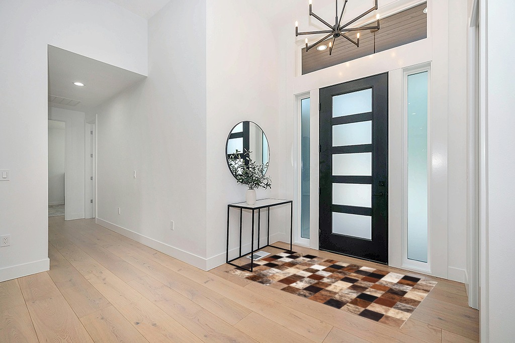 Cowhide rug decor ideas in Modern White Entryway