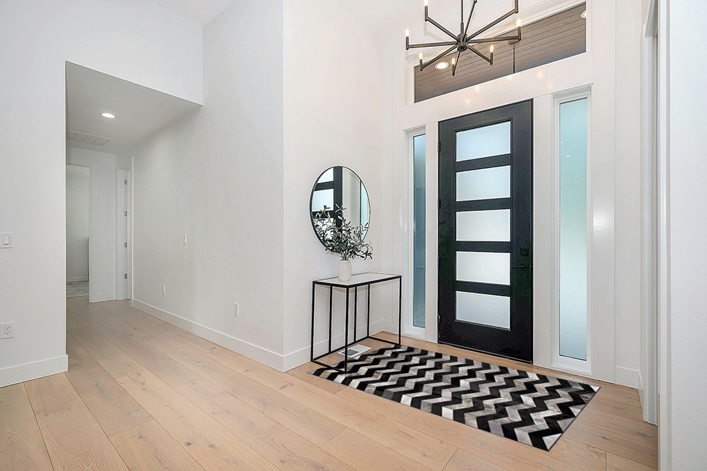 Cowhide rug decor ideas in Modern White Entryway