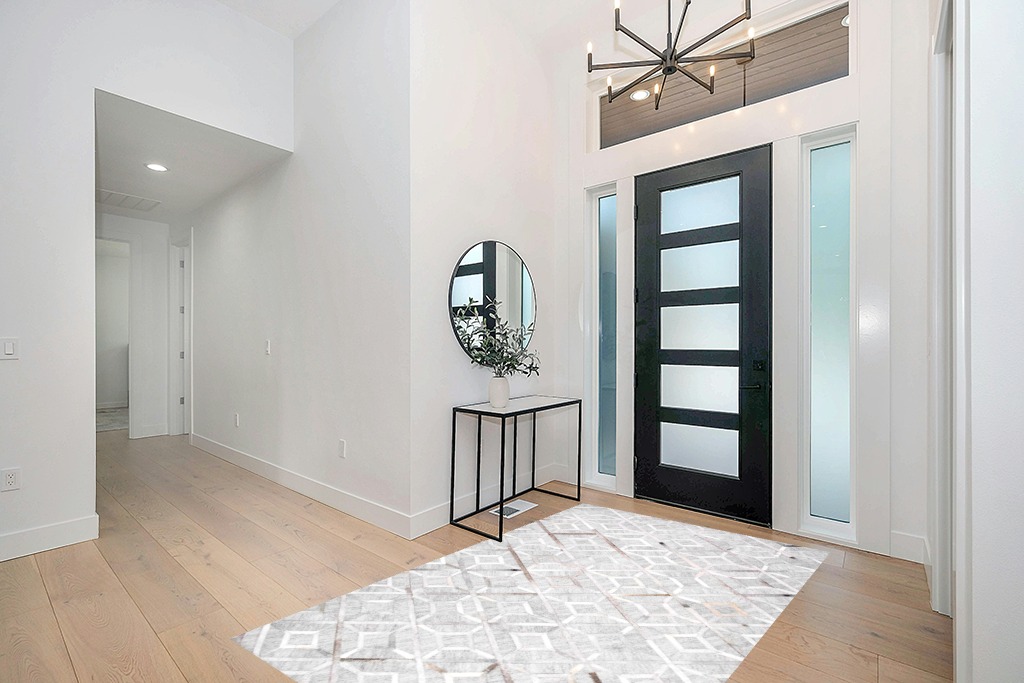 Cowhide rug decor ideas in Modern White Entryway