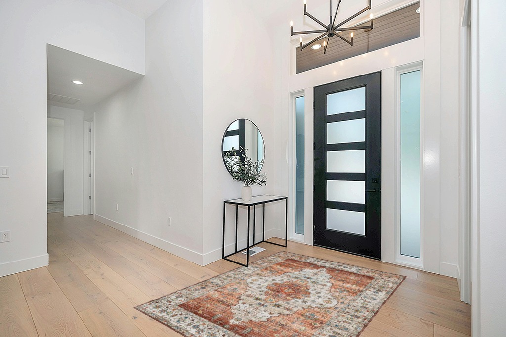 IKALIFE Ultra-Thin Washable Vintage Area Rug 5'x 7' for Living Room, Low-Pile Area Rugs Non-Shed Non Slip, Unique Chenille Printed Home Decor, Perfect for Bedroom Dining Room Kitchen, Orange in Modern White Entryway