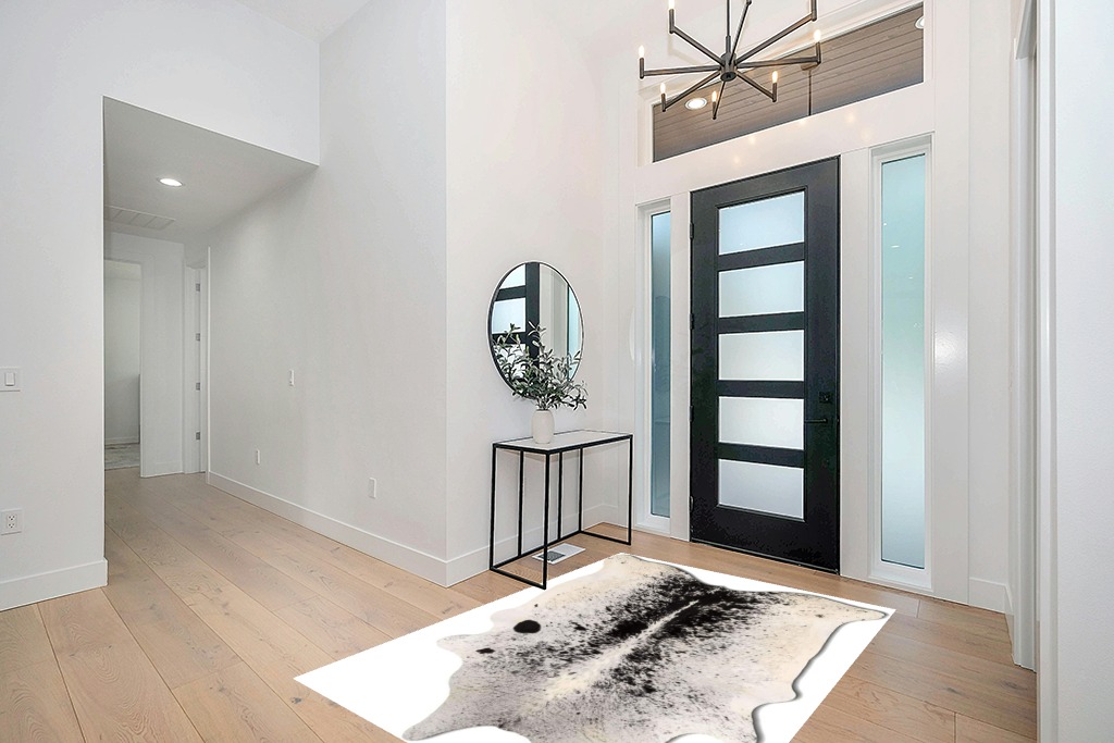 Cowhide rug decor ideas in Modern White Entryway