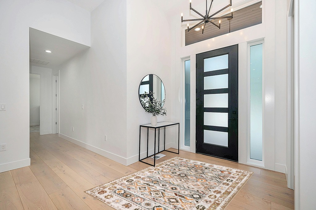 Cowhide rug decor ideas in Modern White Entryway