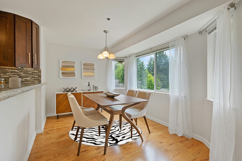 Round dining table rug ideas in Modern White Dining Room with Wooden Accents