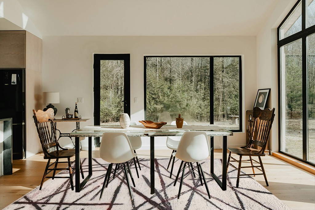 Dining table rug ideas in Modern Scandinavian Dining Room with Black Accents