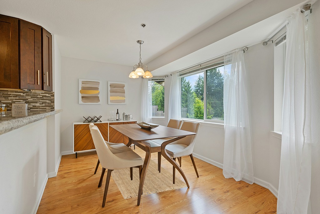 Dining room rug ideas in Modern White Dining Room with Wooden Accents