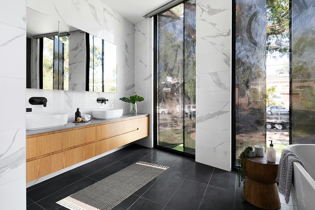 Are black rugs a bad idea in Modern Black Tiled bathroom