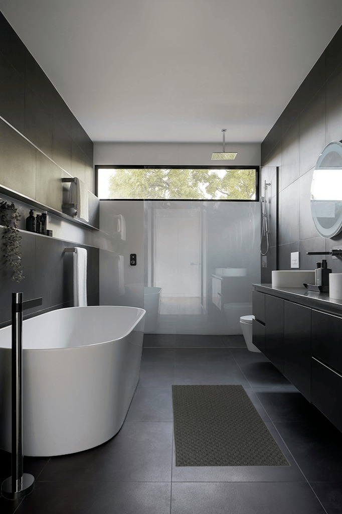 Are black rugs a bad idea in Black Modern Bathroom