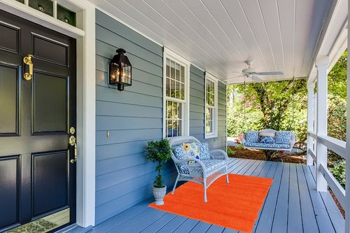 Unique Loom Solid Shag Collection Area Rug (4' 1" x 6' 1" Rectangle, Tiger Orange) in Light Blue Patio