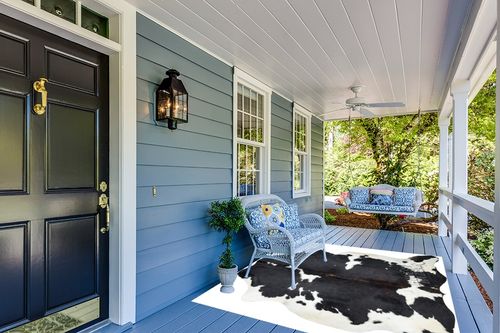 HIDES BAZAAR Dark Tricolor Cowhide Rug, Premium Quality Genuine Leather Cow Hide, Dark Brown, Black and White Area Rug (6x7 ft) in Light Blue Patio