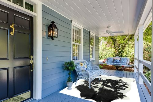 HIDES BAZAAR Classic Black and White Cowhide Rug, Premium Quality Genuine Leather Cow Hide, Area Rug (6x7 ft) in Light Blue Patio