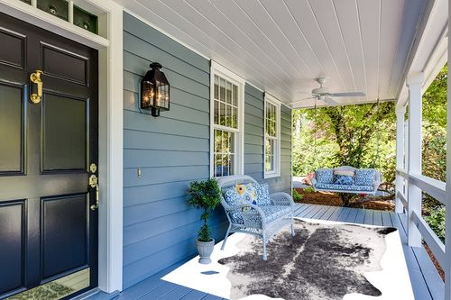 nuLOOM Halina Faux Cowhide Area Rug, 5' 9" x 7' 7", Black in Light Blue Patio