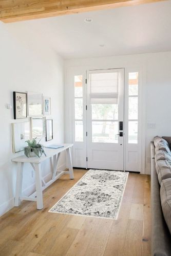Odelia Vintage Bohemian Area Rug in White Scandinavian Entryway