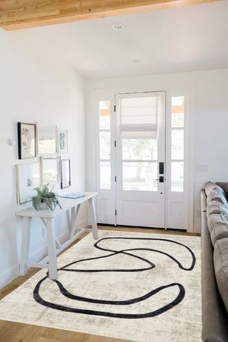 nuLOOM Hayley Modern Abstract Fringe Beige 5 ft. x 8 ft. Area Rug in White Scandinavian Entryway