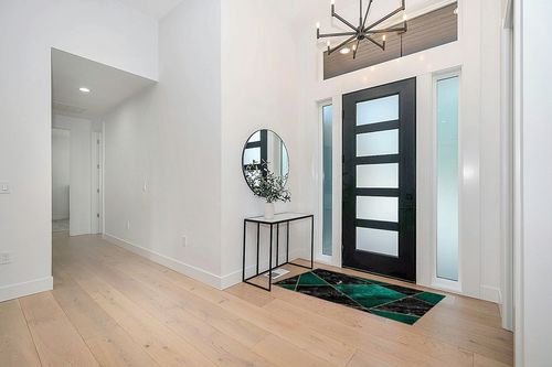 Emerald Green Area Rugs in Modern White Entryway