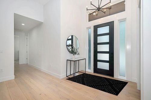 MitoVilla Black and White Rug in Modern White Entryway