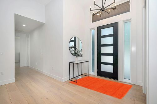 Unique Loom Solid Shag Collection Area Rug (4' 1" x 6' 1" Rectangle, Tiger Orange) in Modern White Entryway
