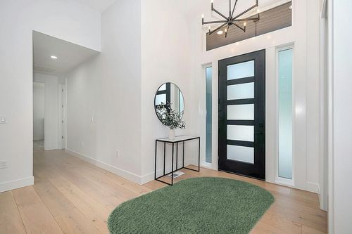 5x8 Oval Green fluffy rug in Modern White Entryway