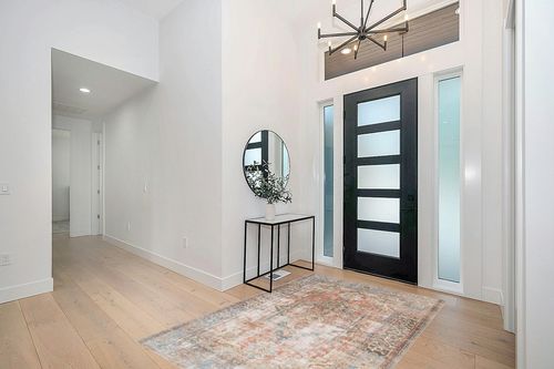 Loloi Rugs Loren 5' x 7'6" Hand Knotted Rug in Terracotta and Blue in Modern White Entryway