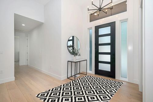 nuLOOM Kellee Hand Tufted Geometric Wool Area Rug, 5x8, Black in Modern White Entryway