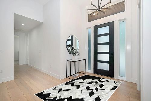 Handmade Black and White Cowhide Patchwork Rug - Black and White with Grayish Stripes Herringbone Chevron Patchwork Cowhide Rug 5 ft X 8 ft in Modern White Entryway