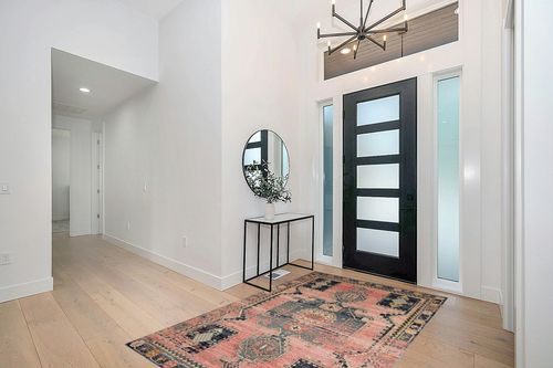 Loloi II Jocelyn Collection JOC-06 Rose/Rose 5'-5" x 7'-6" Area Rug in Modern White Entryway