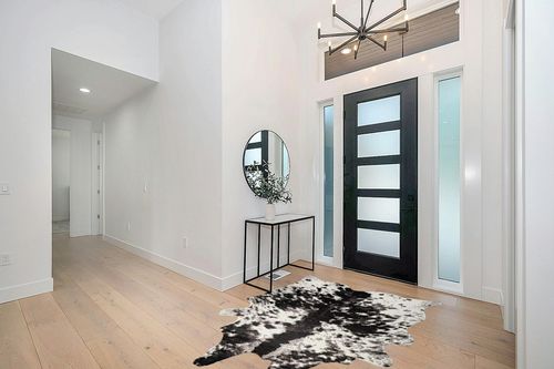 Yincimar Faux Cowhide Rug Extra Large Cow Print Area Rug 5.2ft x 6.6ft Non-Slip Animal Hide Carpet for Bedroom Living Room Western Home Office Decor (Black/Grey/White) in Modern White Entryway