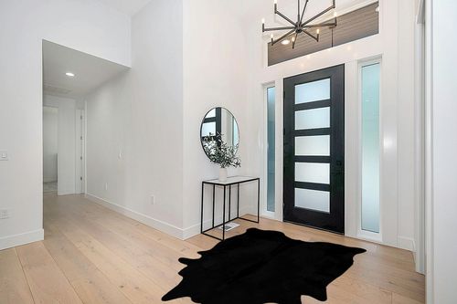 Faux Fur Cowhide Rugs (5 * 7 ft), Machine Washable Cow Print Area Carpet Black Color with Non-Slip Suede Backing, Durable & No Shedding in Modern White Entryway