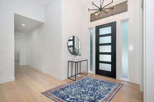 COZYLOOM 5x7 Vintage Bohemian Distressed Rug Oriental Floral Printed Rug Boho Chenille Soft Floor Cover for Living Room Bedroom Non-Slip Low Pile Washable Rug Foldable Thin Blue in Modern White Entryway