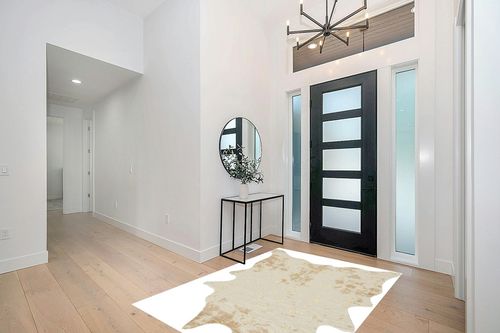 Signature Design by Ashley Jaxith Farmhouse 5 x 7 Medium Pile Cowhide Rug, Ivory & Tan in Modern White Entryway