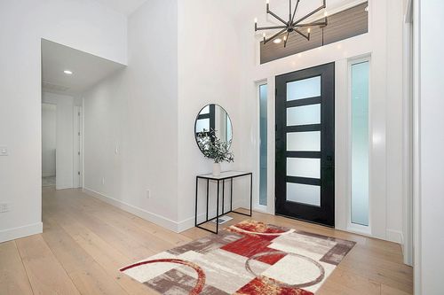 Contemporary Abstract Circle Design Multi Soft 5'3" x 7'3" Indoor Area Rug in Modern White Entryway