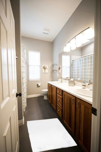 2 x 3 Feet fluffy rug in Wooden and Grey Bathroom
