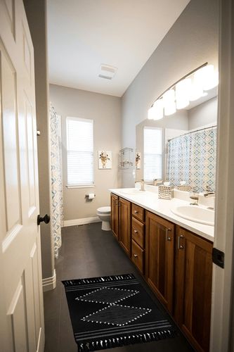 MitoVilla Black Boho Rug in Wooden and Grey Bathroom