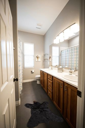 Carstens Plush Black Bear Kids Animal Rug Small in Wooden and Grey Bathroom