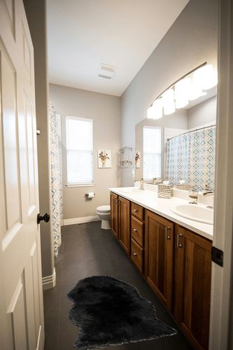 Silky Soft Faux Fur Rug, 2 ft. x 3 ft. Black Fluffy Rug, Sheepskin Area Rug, Shaggy Rug for Living Room, Bedroom, Kid's Room, or Nursery, Home Décor Accent, Machine Washable with Non-Slip Backing in Wooden and Grey Bathroom