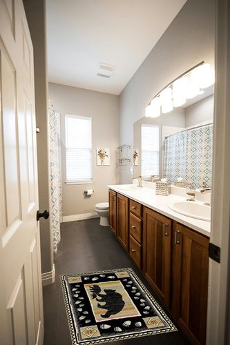 Rug Empire Take the Lead Black Bear Rustic Lodge Area Rug - 26" W X 39" L in Wooden and Grey Bathroom