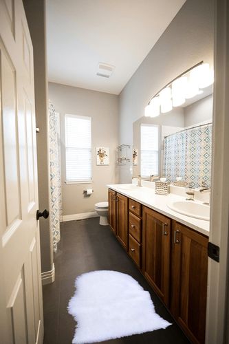 Dikoaina Classic Soft Faux Sheepskin Fur Rug White Fluffy Area Rug Shag Rug Carpets for Bedroom Living Room in Wooden and Grey Bathroom