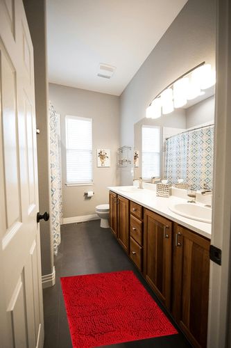 BOANKODU Bathroom Rugs Sets 2 Piece, Extra Soft Chenille Bath Mat Absorbent Bathroom Rug, Bathroom Mat with Sturdy PVC Non-Slip Bottom, Machine Washable Bath Rugs (32x20 Inch + 24x16 Inch, Red) in Wooden and Grey Bathroom