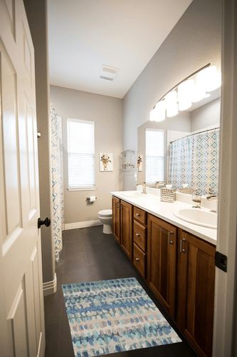 Dash and Albert Paint Chip Blue Hand Micro Hooked Wool Rug, 2 X 3 Feet, Blue/Green Geometric Pattern in Wooden and Grey Bathroom