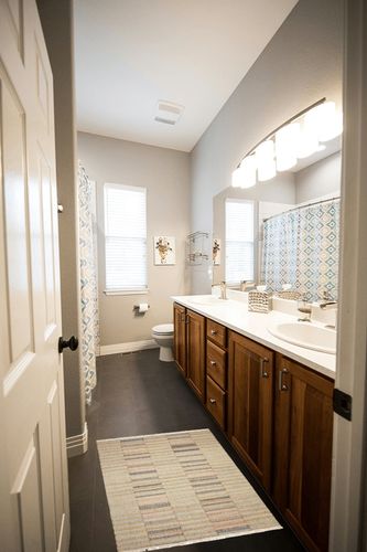 Dash & Albert Ravel Stripe Handwoven Wool Rug, 2 X 3 Feet, Neutral/Blue Geometric Pattern in Wooden and Grey Bathroom