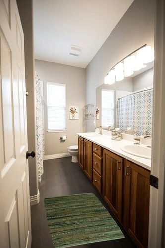 DII Chindi Home Collection Handwoven Multicolor Area Rag Run, 20x31.5, Olive Green in Wooden and Grey Bathroom