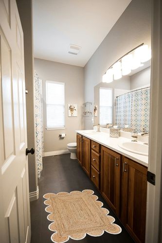 Weaving Village Scalloped Natural Jute Area Rug, Colored Trim in Wooden and Grey Bathroom