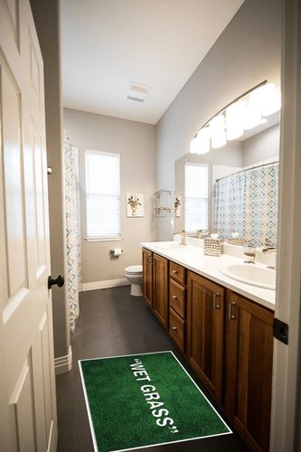 Add a Pop of Green to Your Home with Our Soft & Non-Slip Wet Grass Rug - Perfect for Bedroom, Bathroom, and More! (24x35in) in Wooden and Grey Bathroom